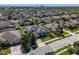 Aerial view of house in neighborhood with mature landscaping and fenced backyard at 713 Duff Dr, Winter Garden, FL 34787