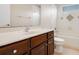 Bathroom featuring vanity with solid surface countertop, toilet, and tiled shower-tub combination at 713 Duff Dr, Winter Garden, FL 34787