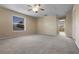 Carpeted bedroom with neutral walls and light coming in from the window at 713 Duff Dr, Winter Garden, FL 34787