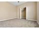 Carpeted bedroom with a closet and neutral walls, creating a versatile and comfortable space at 713 Duff Dr, Winter Garden, FL 34787