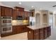 Gourmet kitchen with stainless steel appliances and custom cabinetry at 713 Duff Dr, Winter Garden, FL 34787