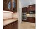 Kitchen with custom cabinets, stainless steel appliances, and ample counter space at 713 Duff Dr, Winter Garden, FL 34787