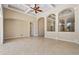 Expansive living space with tile floors, tray ceiling, and arched doorways at 713 Duff Dr, Winter Garden, FL 34787