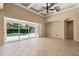 Open living area with sliding glass doors to the pool area and tiled floors at 713 Duff Dr, Winter Garden, FL 34787