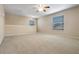 Spacious loft area with neutral carpet, paint and views through the window at 713 Duff Dr, Winter Garden, FL 34787