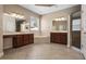 Main bathroom featuring dual sinks, soaking tub, walk in shower, and tile flooring at 713 Duff Dr, Winter Garden, FL 34787