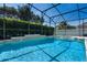 Inviting screened-in pool with spa offers a refreshing retreat in a private backyard setting at 713 Duff Dr, Winter Garden, FL 34787