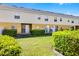 A wide view of the backyard featuring lush green grass and trimmed shrubbery at 723 Marotta Loop, Ocoee, FL 34761