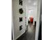 Hallway with a view into a bedroom with dark wood floors at 7531 Marietta St, Orlando, FL 32807