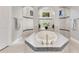 Close-up of a luxurious bathroom featuring a soaking tub and a separate tiled shower at 8718 Shimmering Pine Pl, Sanford, FL 32771