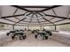 Interior shot of a community picnic pavilion equipped with tables and ceiling fans at 8718 Shimmering Pine Pl, Sanford, FL 32771