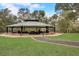 Community pavilion perfect for outdoor gatherings, with picnic tables and stone accents at 8718 Shimmering Pine Pl, Sanford, FL 32771