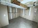 Unfinished basement featuring bare concrete floors and exposed beams, offering potential for customization at 8801 Hackney Prairie Rd, Orlando, FL 32818