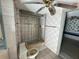 Bathroom features a tiled shower and vintage fixtures at 8801 Hackney Prairie Rd, Orlando, FL 32818