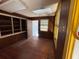 Bedroom showcasing hardwood floors, built-in shelving, and natural light from a window at 8801 Hackney Prairie Rd, Orlando, FL 32818