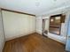 Bedroom features hardwood floors, a built-in cabinet, and unique wall and trim details at 8801 Hackney Prairie Rd, Orlando, FL 32818