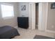 This bedroom includes closet space, wood-look floors and minimalist decor at 919 N Hastings St, Orlando, FL 32808