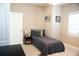 Comfortable bedroom featuring a stylish decor, ample natural light, and wood-look floors at 919 N Hastings St, Orlando, FL 32808