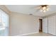 Bedroom with large window and a closet with bi-fold louvered doors at 926 Ensenada Dr, Orlando, FL 32825