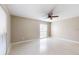 Bright bedroom featuring a large window providing natural light and a ceiling fan at 926 Ensenada Dr, Orlando, FL 32825