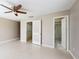 Spacious main bedroom featuring dual closets and an en-suite bathroom with a shower at 926 Ensenada Dr, Orlando, FL 32825