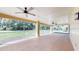 Spacious screened-in porch with tiled floors and ceiling fans, perfect for outdoor relaxation at 926 Ensenada Dr, Orlando, FL 32825