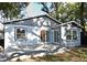 Backyard deck with sliding door, windows, gray siding and dark trim at 938 S Bumby Ave, Orlando, FL 32806