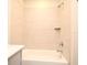 Bathroom with soaking tub, shower head and wall tiles at 938 S Bumby Ave, Orlando, FL 32806