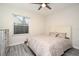 Bedroom with a window for natural light, wood-look floors, and a dresser at 938 S Bumby Ave, Orlando, FL 32806