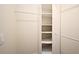 Walk-in closet with shelving units and hanging rods for optimal storage at 938 S Bumby Ave, Orlando, FL 32806