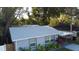 View of the home showing the roof, side yard and landscaping around the house at 938 S Bumby Ave, Orlando, FL 32806