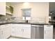 Close up of stainless steel dishwasher and kitchen sink at 938 S Bumby Ave, Orlando, FL 32806