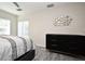 Main bedroom featuring a modern dresser, stylish wall decor, and a sliding glass door to the outdoors at 938 S Bumby Ave, Orlando, FL 32806