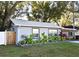 Charming home with a green lawn and attractive landscaping at 938 S Bumby Ave, Orlando, FL 32806