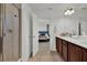 Bathroom with wood cabinets, dual sinks and walk-in shower adjacent to bedroom at 17019 Seville Orange Rd, Winter Garden, FL 34787