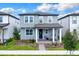Charming two-story home with welcoming front porch, landscaped yard and covered entry at 17019 Seville Orange Rd, Winter Garden, FL 34787