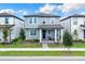 Charming two-story home with welcoming front porch, landscaped yard and covered entry at 17019 Seville Orange Rd, Winter Garden, FL 34787