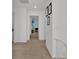 Hallway with artwork and a view into an office space at 17019 Seville Orange Rd, Winter Garden, FL 34787