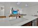 Spacious kitchen featuring a large island with quartz countertop and modern faucet at 17019 Seville Orange Rd, Winter Garden, FL 34787