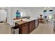 Spacious kitchen featuring a large island with quartz countertop and modern faucet at 17019 Seville Orange Rd, Winter Garden, FL 34787