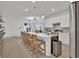 Bright, spacious kitchen with white cabinets, stainless steel appliances, and quartz countertops at 17019 Seville Orange Rd, Winter Garden, FL 34787