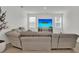 Comfortable living room with entertainment center, providing ample space for relaxation at 17019 Seville Orange Rd, Winter Garden, FL 34787