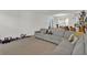 Comfortable living room featuring a reclining couch, overhead lighting, and neutral décor at 17019 Seville Orange Rd, Winter Garden, FL 34787
