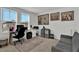 Well-lit office space with a desk, chair, and artwork for a comfortable work environment at 17019 Seville Orange Rd, Winter Garden, FL 34787