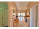 Hallway leading to a spacious living area with tile floors and ample natural light at 1010 High Vista Dr, Davenport, FL 33837