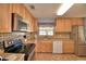 Well-lit kitchen featuring a stainless steel microwave and modern appliances at 1010 High Vista Dr, Davenport, FL 33837