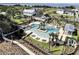 Stunning aerial view of a community pool with lounge chairs and a beautiful clubhouse at 1024 Prosperity Dr, Winter Garden, FL 34787