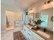 Elegant bathroom with double vanity, walk-in shower, and stylish decor at 1024 Prosperity Dr, Winter Garden, FL 34787