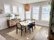 Dining area featuring modern table with decorative pendant lighting and window shutters at 1024 Prosperity Dr, Winter Garden, FL 34787