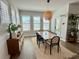 Bright dining room featuring modern furnishings, natural light, and stylish decor at 1024 Prosperity Dr, Winter Garden, FL 34787